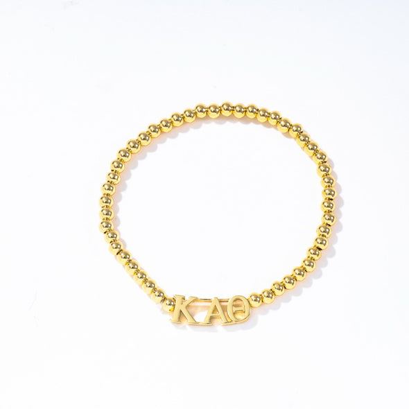 B211 - Sorority: Gold Beaded Bracelet with Greek Letters on Stretch Cord